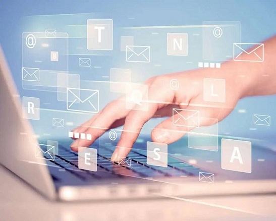 Hand typing on keyboard with digital tech icons